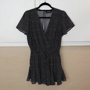 Medium flutter sleeve black romper with white heart pattern